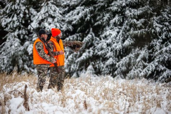 How do layers stay warm while hunting?