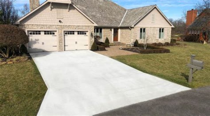 How long should you wait to drive on a new concrete driveway?
