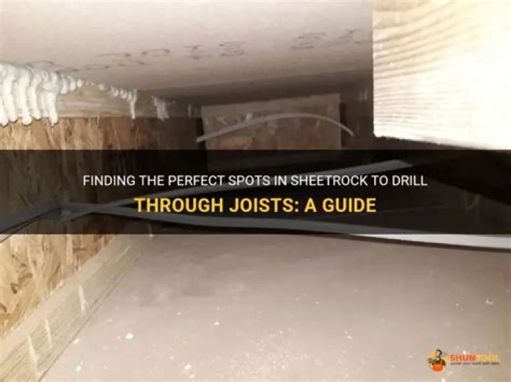 Is it OK to drill through joists?