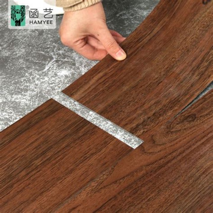 Is it OK to use tar paper under laminate flooring?